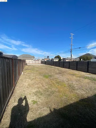 a view of a swimming pool with a yard
