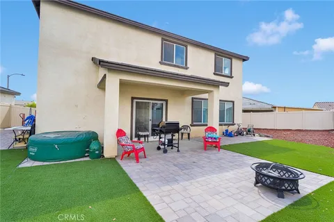 a backyard of a house with seating space