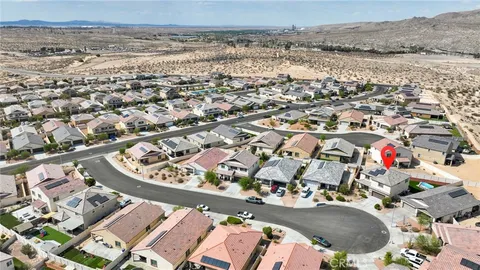 an aerial view of a house with a ocean view