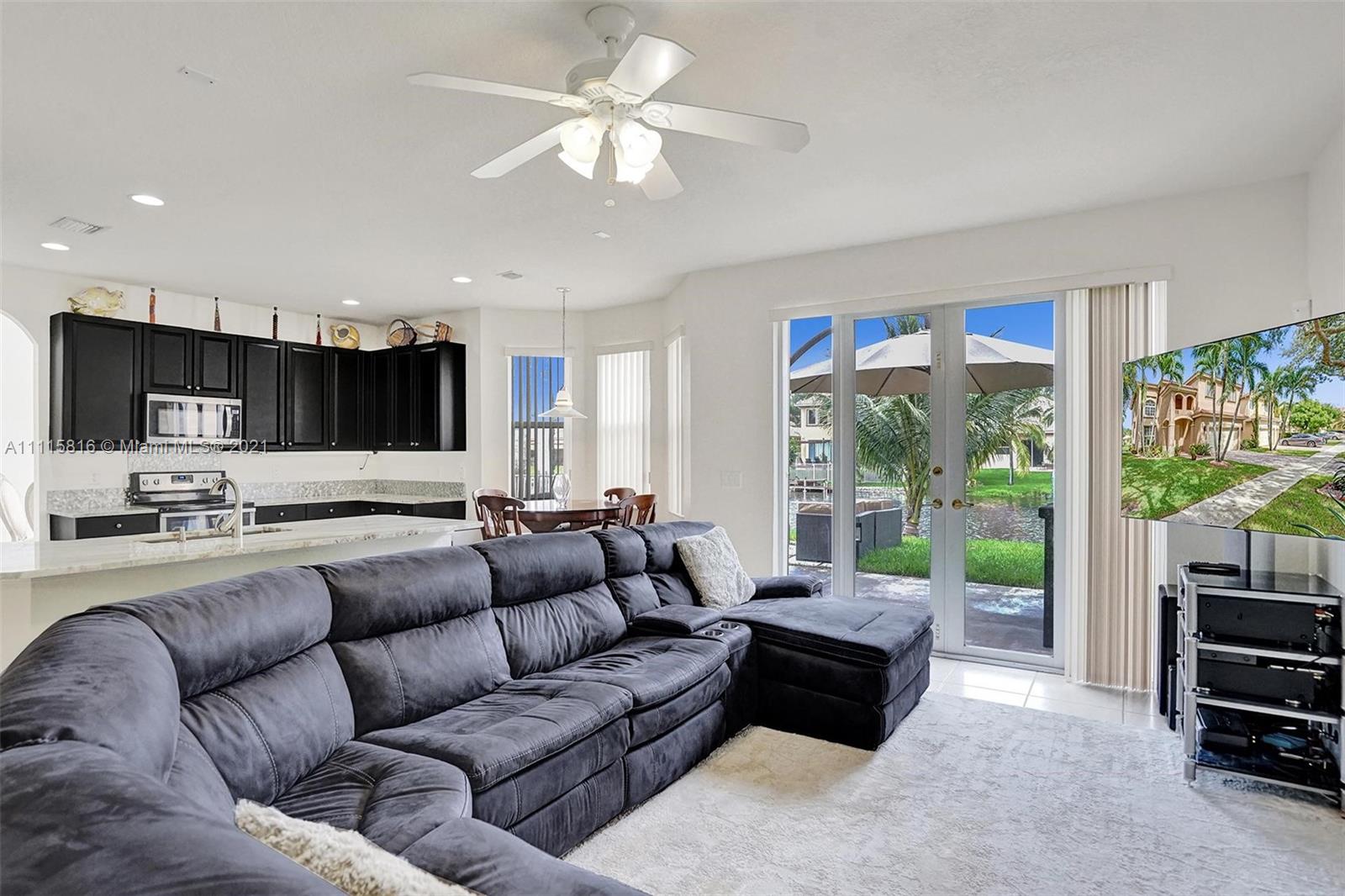 13333 Southwest 31st Street Miramar, FL 33027 - Photo 22 of 85 a living room with furniture and a large window