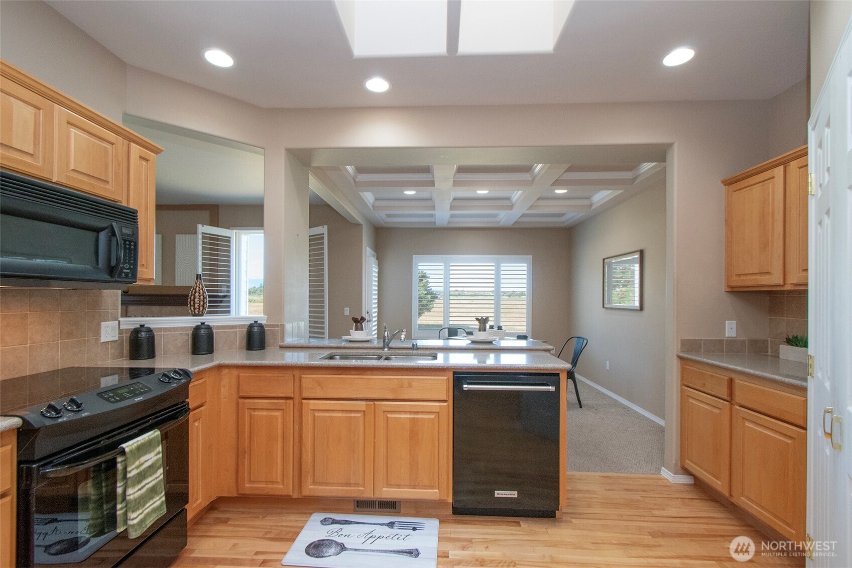 40 Cascadia Loop Sequim, WA 98382 - Photo 22 of 40 a kitchen with a sink stove and cabinets