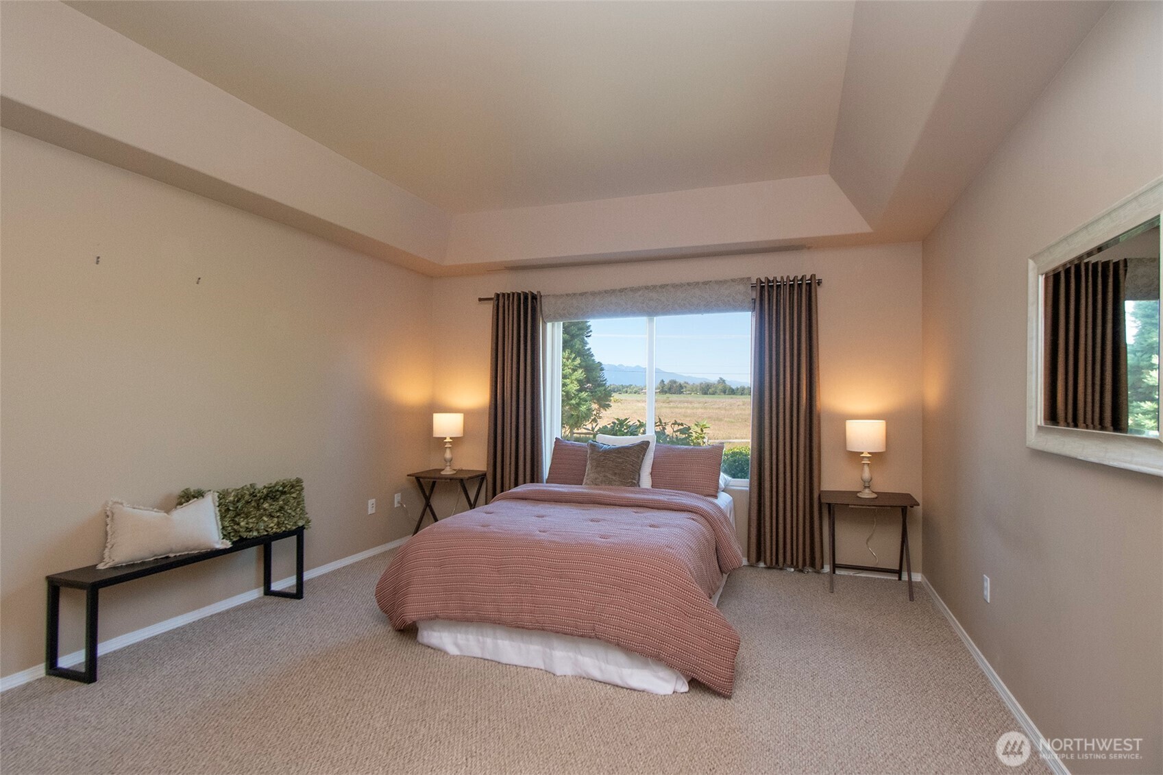 40 Cascadia Loop Sequim, WA 98382 - Photo 26 of 40 a bed room with a bed and a lamp