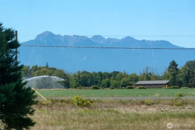 a view of a town with mountains in the background