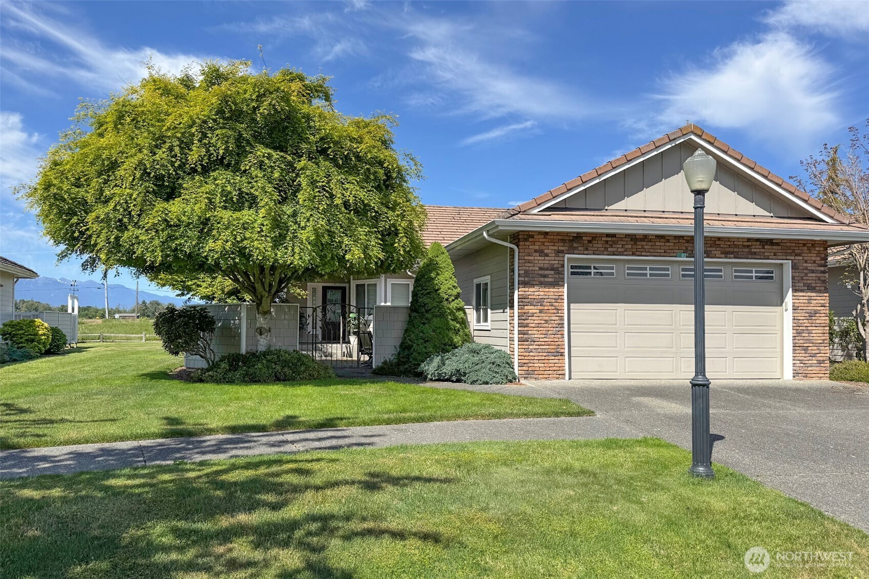 40 Cascadia Loop Sequim, WA 98382 - Photo 3 of 40 a front view of a house with garden