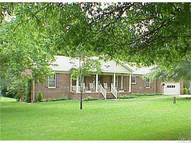 1751 Spring Valley Lake Road Henderson, NC 27537 - Photo 1 of 1 a front view of house with a garden