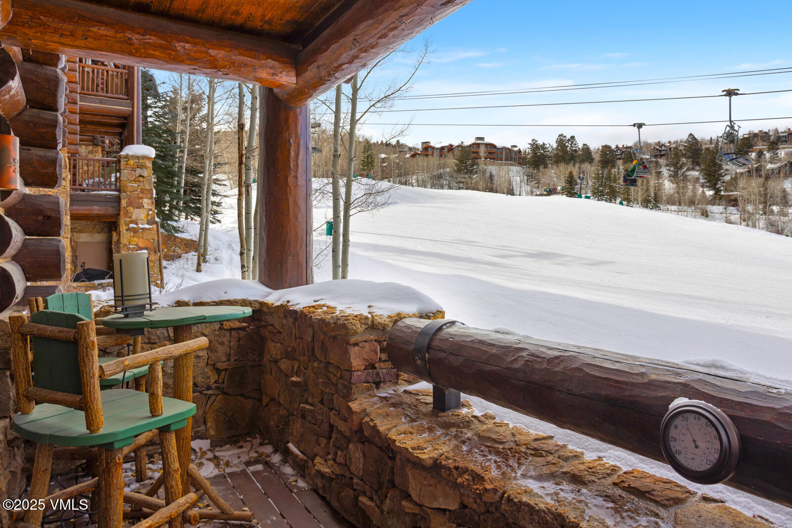 a living room filled with furniture and a floor to ceiling window