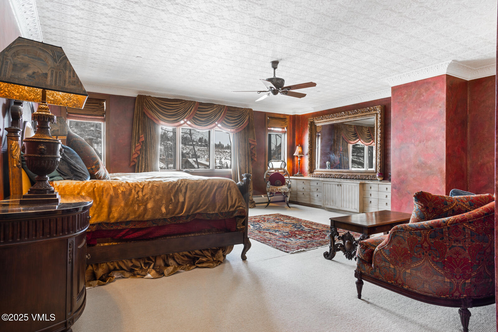 180 Daybreak Ridge Road, Unit 410 Avon, CO 81620 - Photo 12 of 30 a bedroom with a bed couch and window