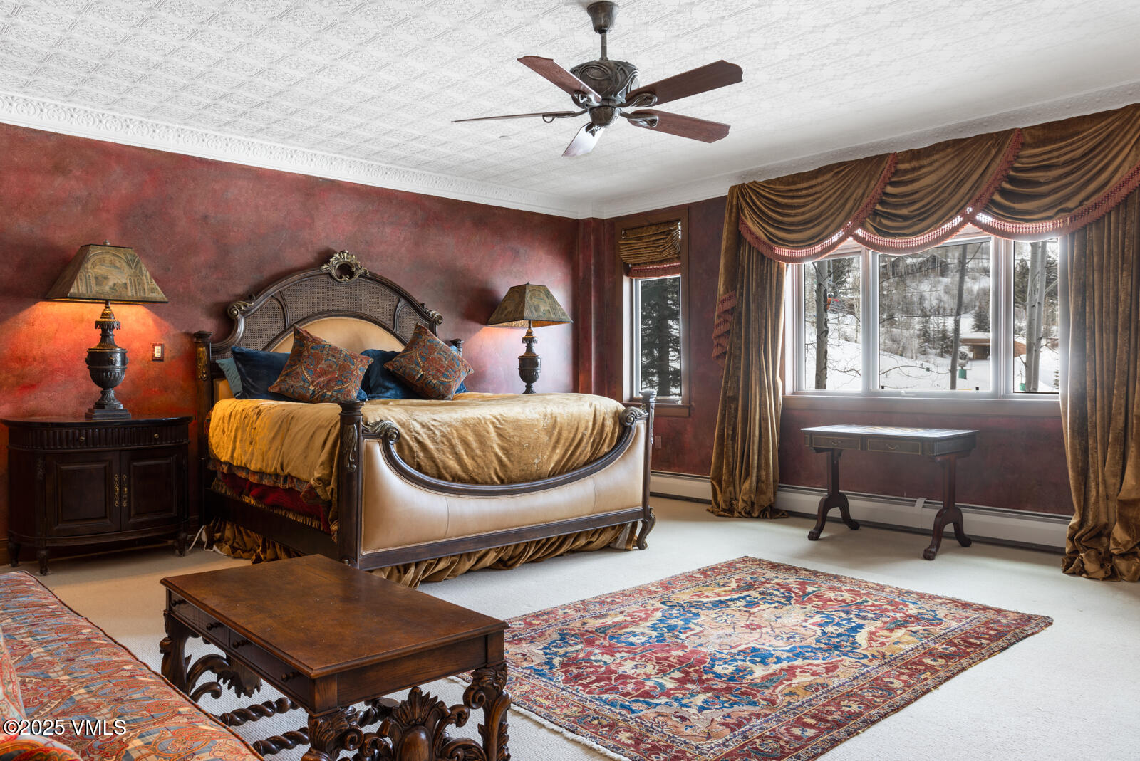 180 Daybreak Ridge Road, Unit 410 Avon, CO 81620 - Photo 14 of 30 a living room with furniture a rug and a chandelier