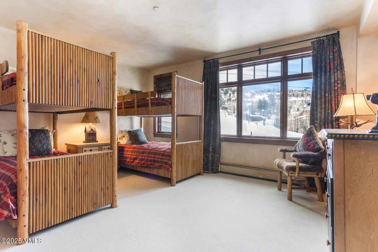 180 Daybreak Ridge Road, Unit 410 Avon, CO 81620 - Photo 21 of 30 a bedroom with furniture and a window