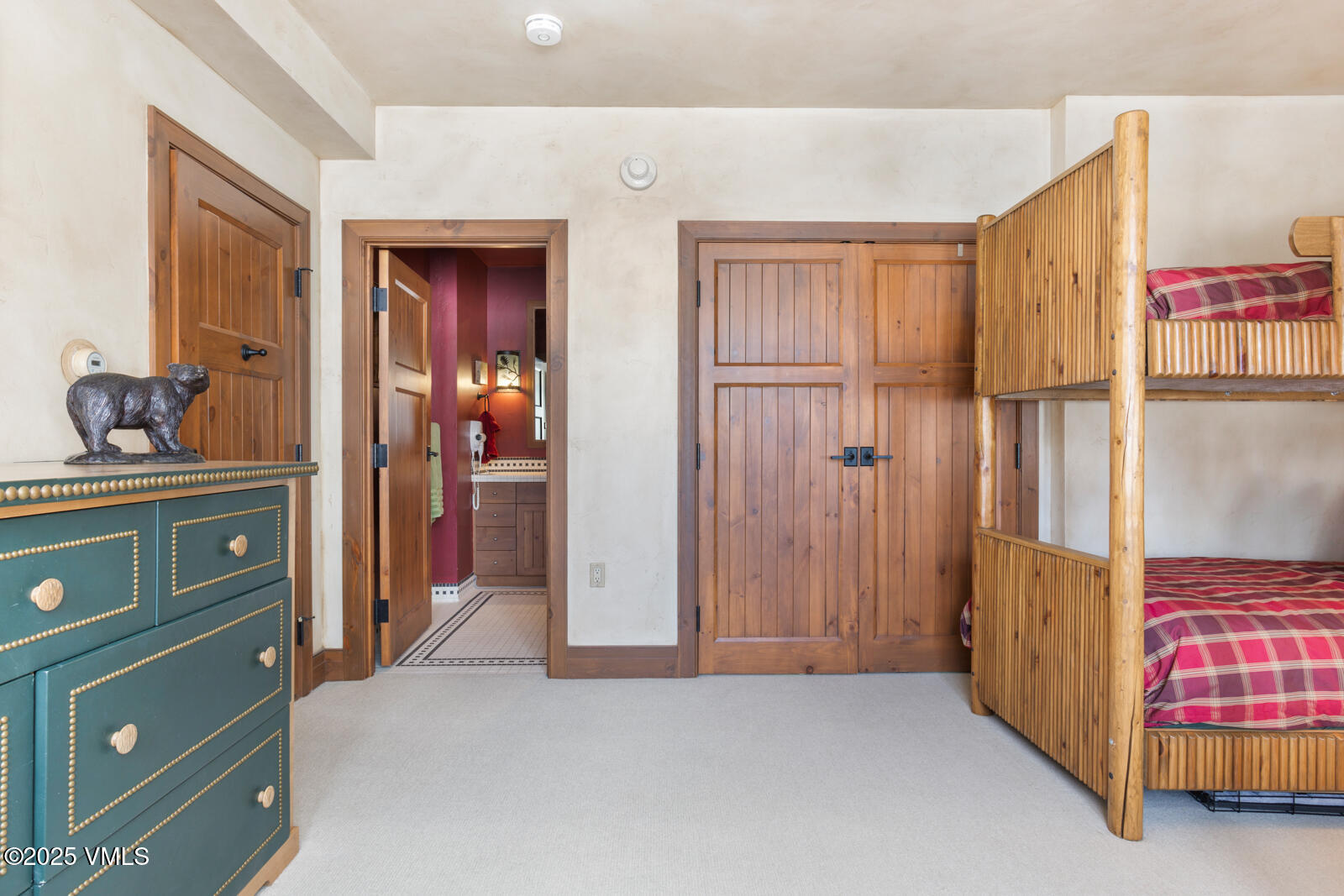 180 Daybreak Ridge Road, Unit 410 Avon, CO 81620 - Photo 22 of 30 a view of a bedroom with a wardrobe space