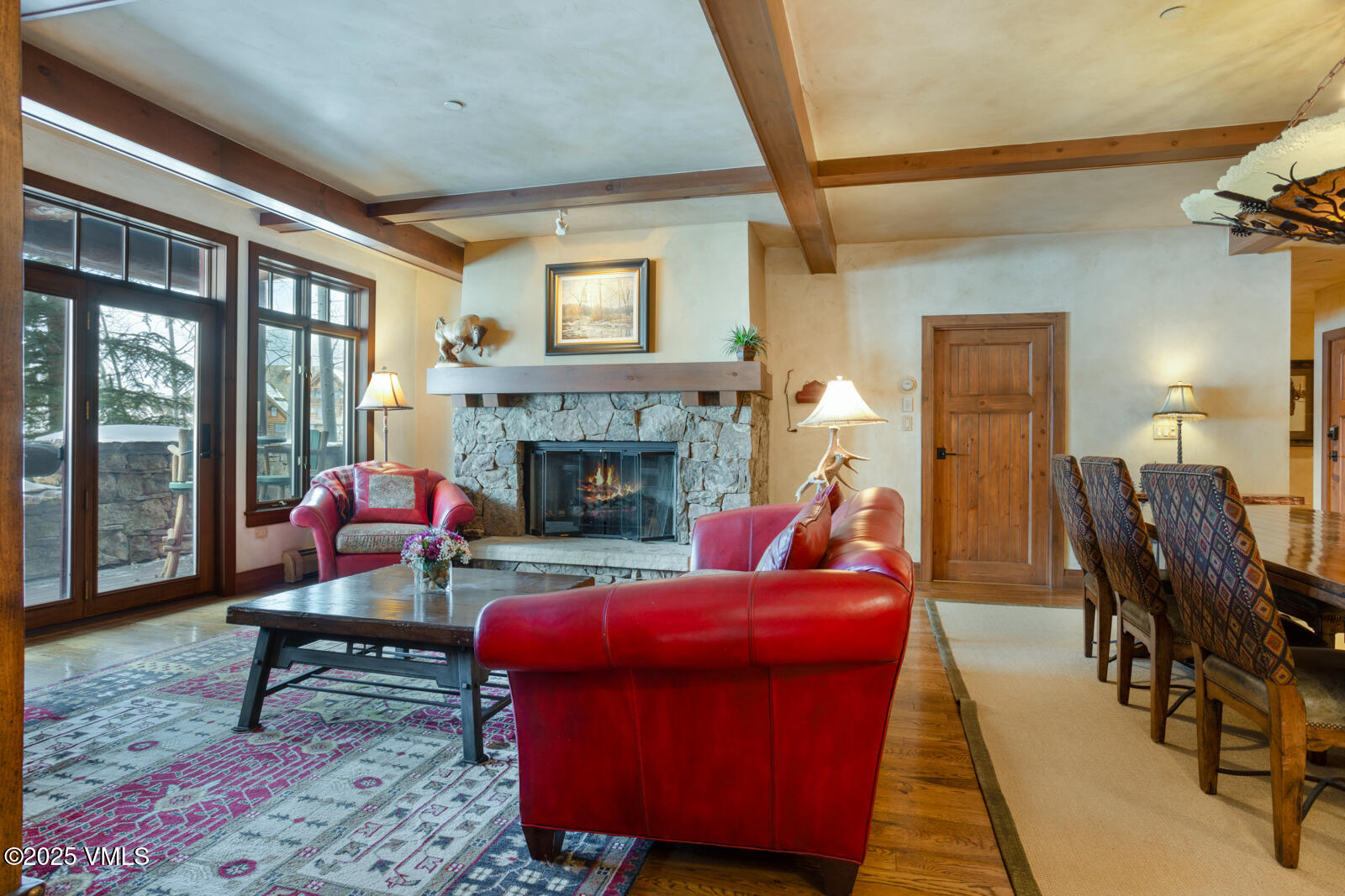 180 Daybreak Ridge Road, Unit 410 Avon, CO 81620 - Photo 5 of 30 a living room with furniture and a fireplace