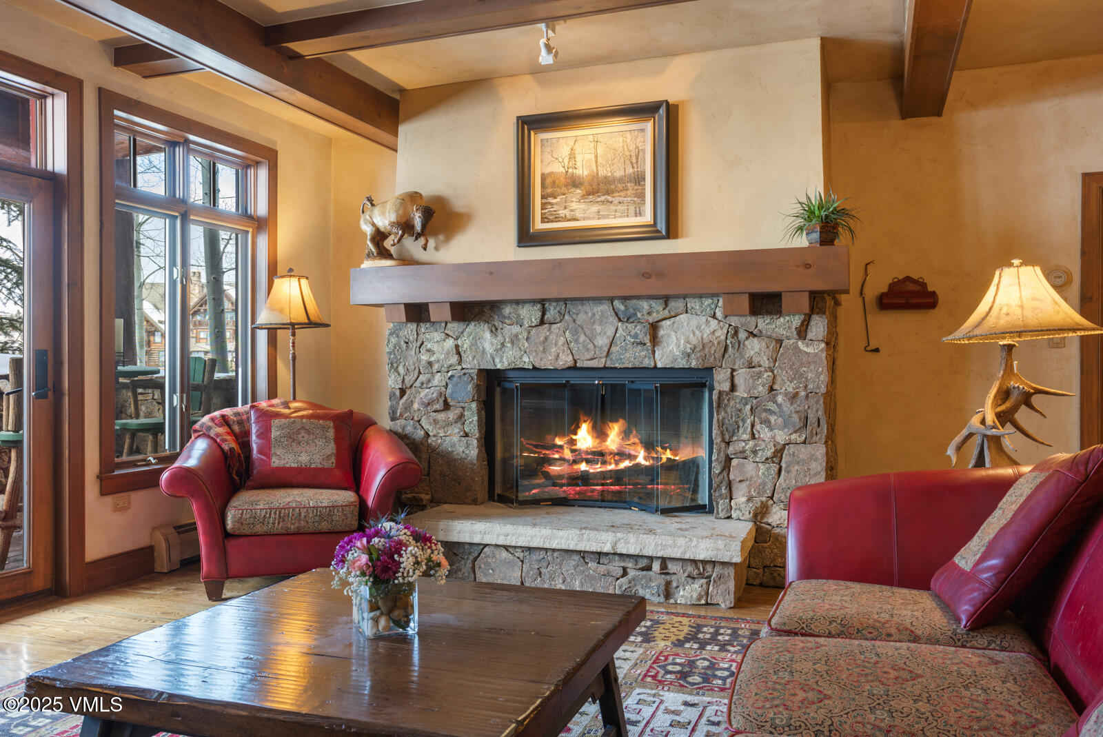 180 Daybreak Ridge Road, Unit 410 Avon, CO 81620 - Photo 7 of 30 a living room with furniture and a fireplace