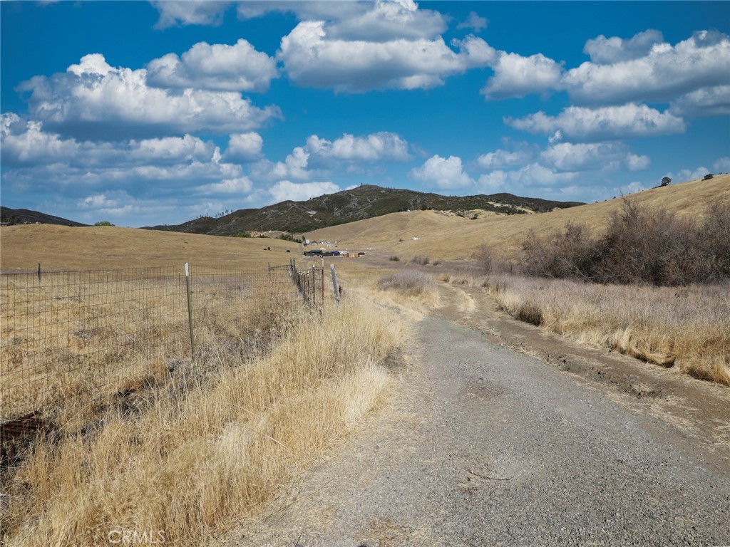 9520 Rocky Creek Road Lower Lake, CA 95457 - Photo 19 of 40 a view of a dry yard with wooden fence