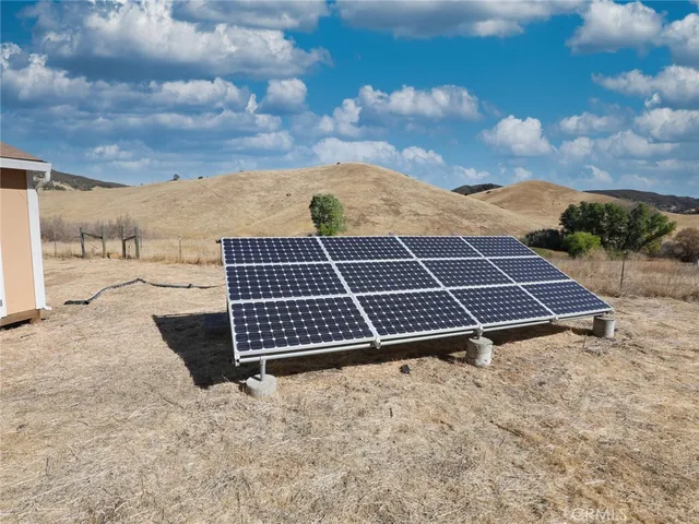 a view of a terrace with a table and chairs