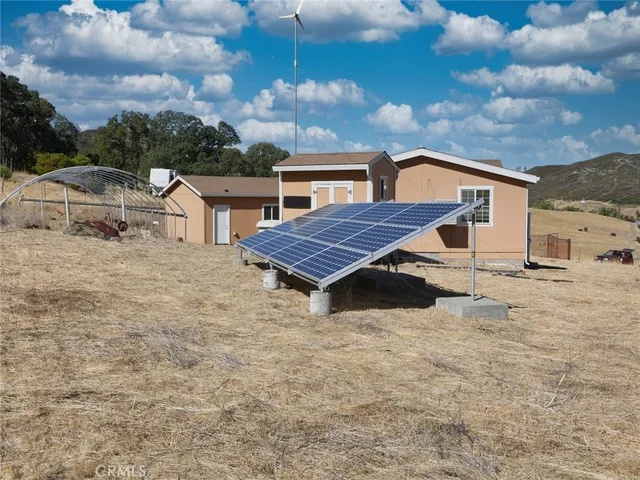 a kitchen with stainless steel appliances granite countertop a sink a refrigerator and a stove