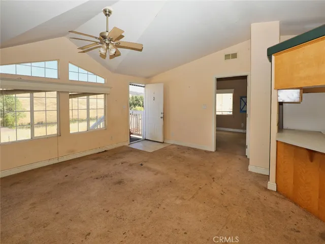 a view of an empty room with a window