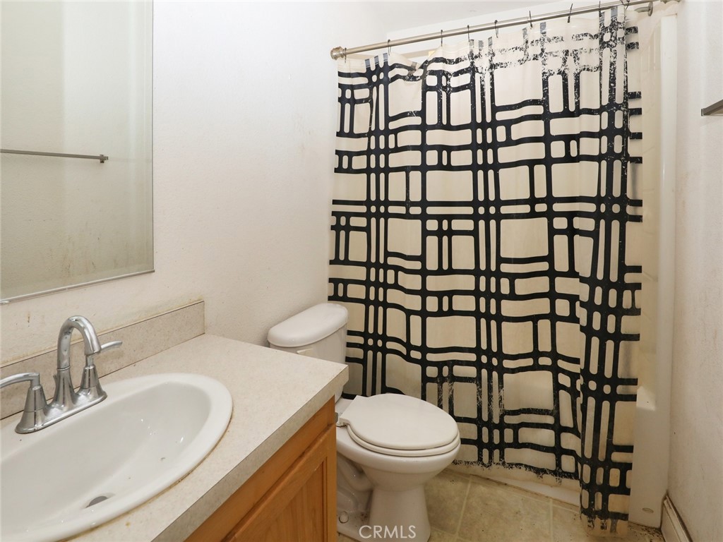9520 Rocky Creek Road Lower Lake, CA 95457 - Photo 33 of 40 a bathroom with a sink toilet and shower