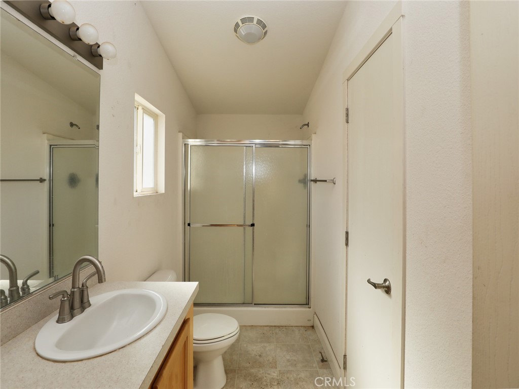 9520 Rocky Creek Road Lower Lake, CA 95457 - Photo 36 of 40 a bathroom with a sink toilet and shower