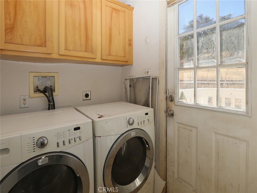 9520 Rocky Creek Road Lower Lake, CA 95457 - Photo 39 of 40 a utility room with dryer and washer