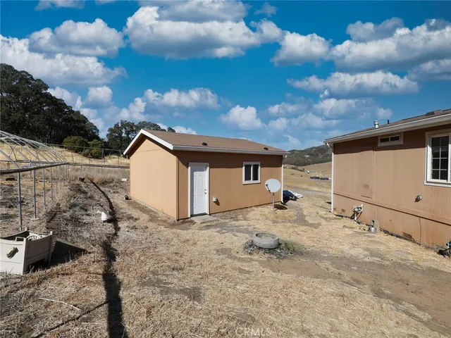 a view of a house with a snow in the background