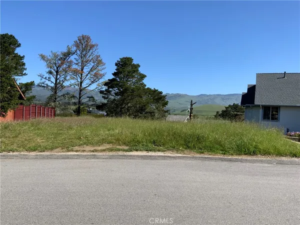 a view of a road with a building in the background