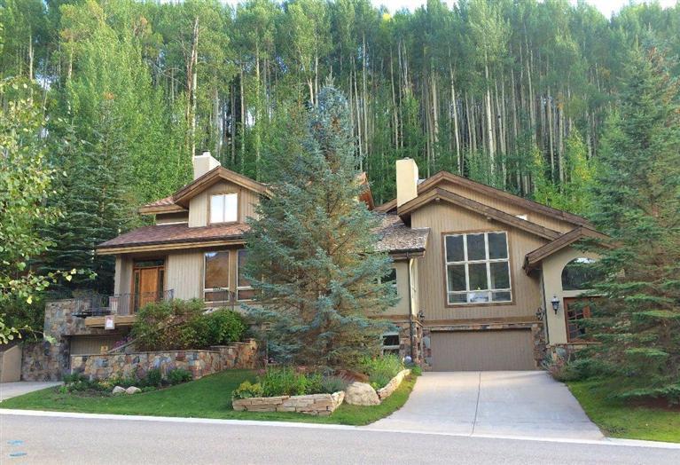 716 West Forest Road, Unit B Vail, CO 81657 - Photo 1 of 8 a front view of a house with a garden