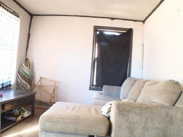 a bedroom with a bed and a mirror