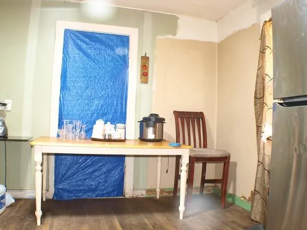 a view of dining room with furniture and wooden floor