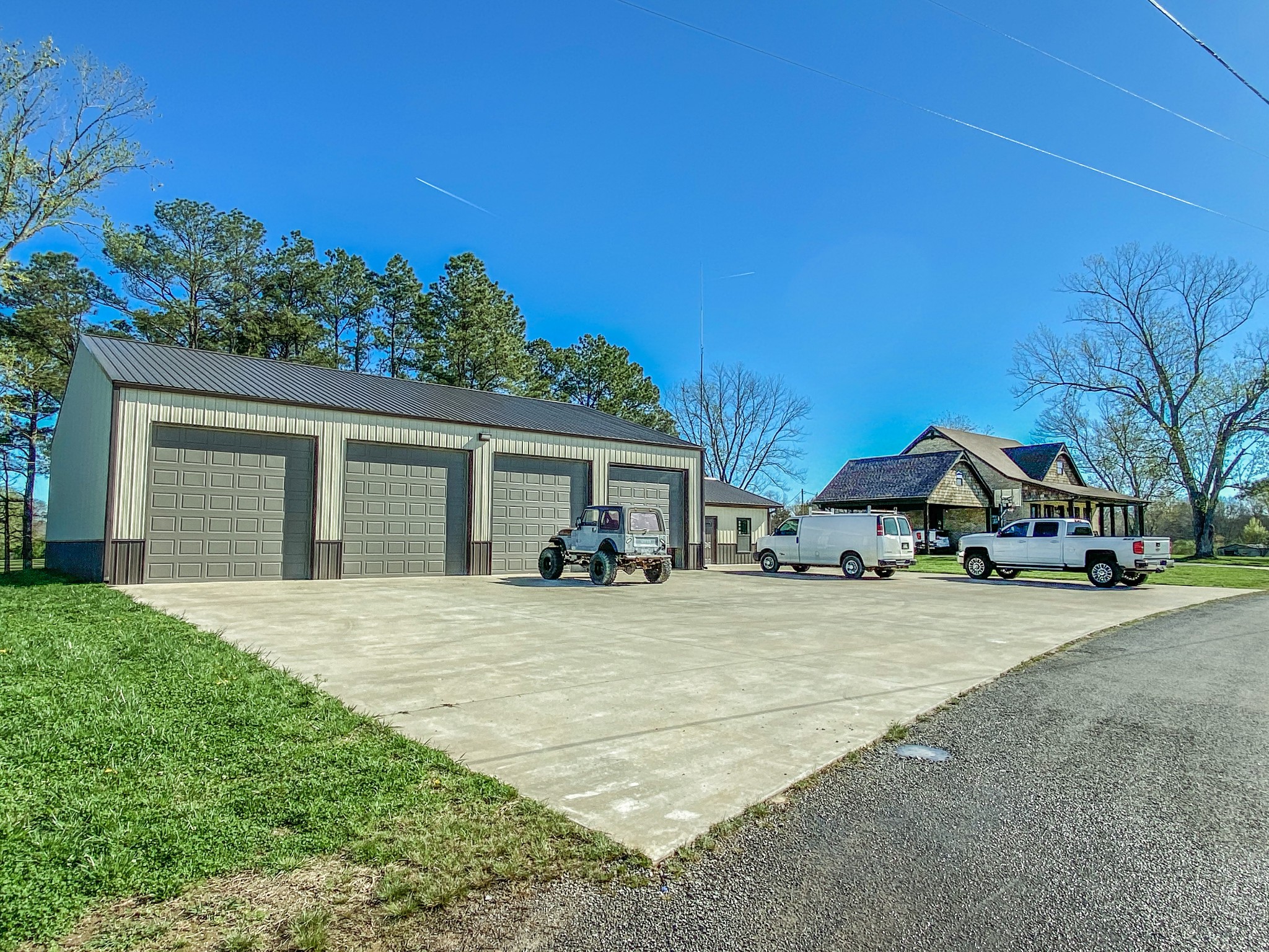107 Walnut Grove Road Unionville, TN 37180 - Photo 2 of 21 a front view of a house with a yard and garage