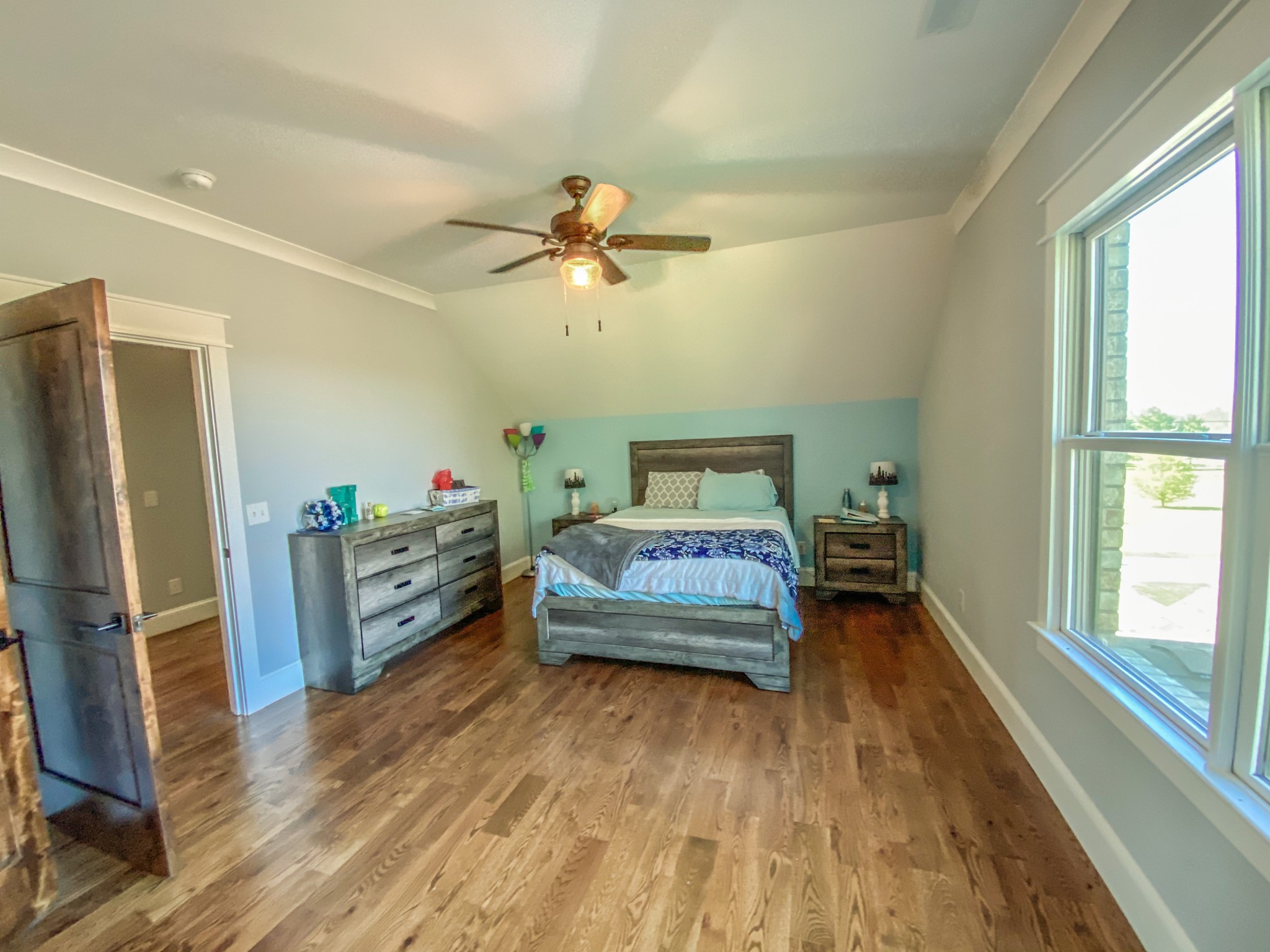 107 Walnut Grove Road Unionville, TN 37180 - Photo 13 of 21 a bedroom with a bed and wooden floor