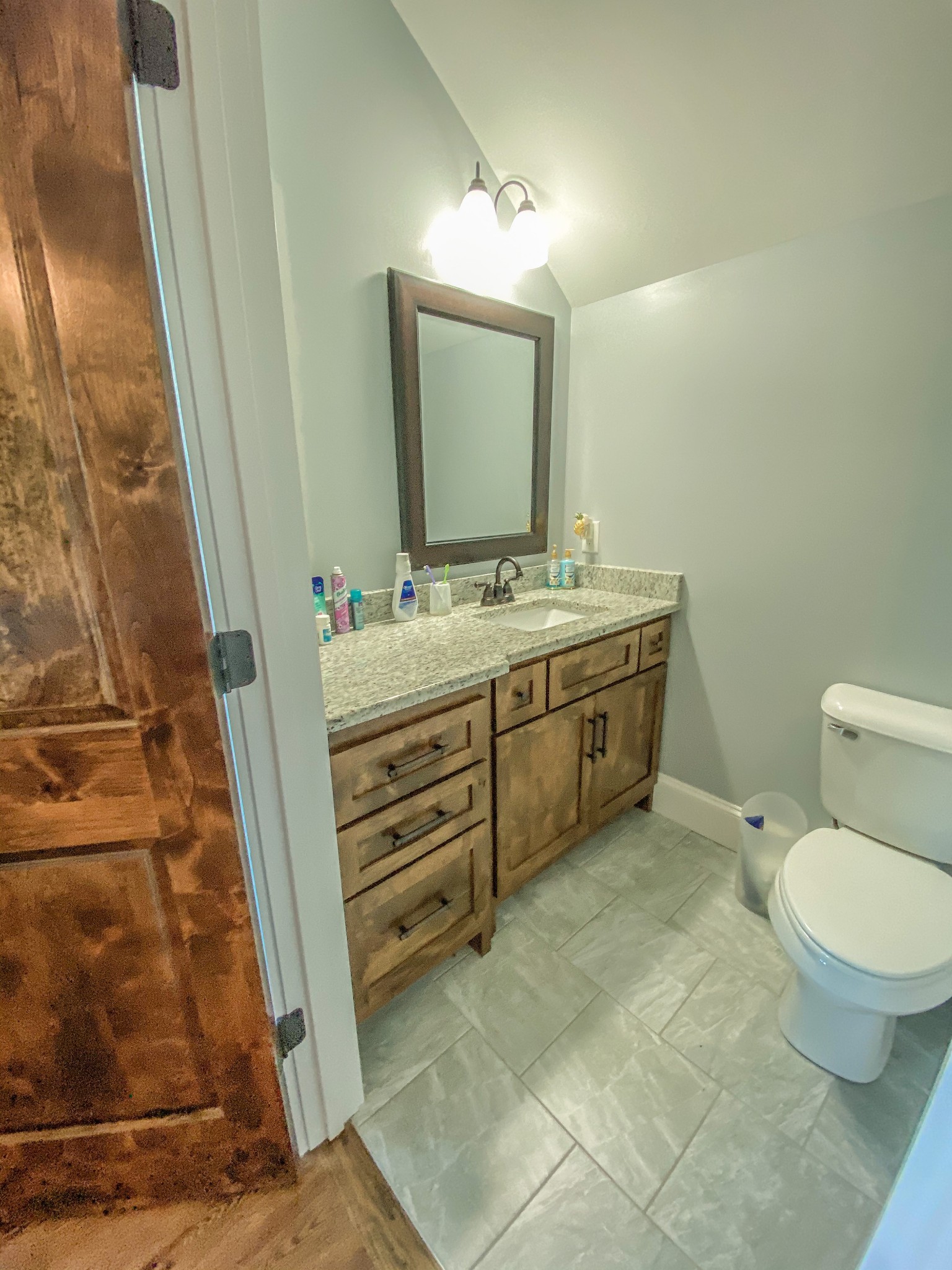 107 Walnut Grove Road Unionville, TN 37180 - Photo 14 of 21 a bathroom with a toilet sink and mirror