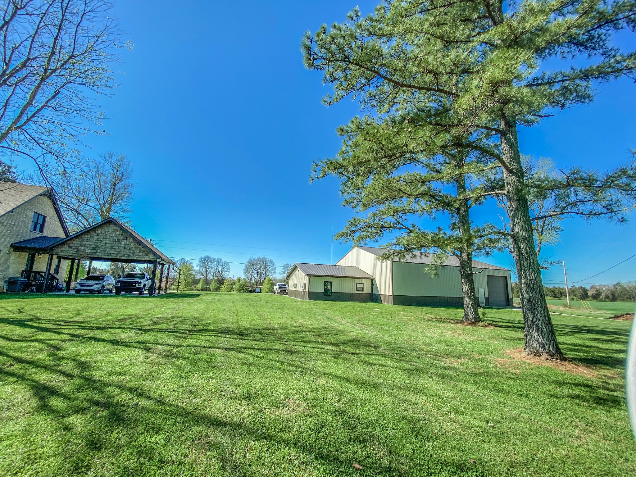 107 Walnut Grove Road Unionville, TN 37180 - Photo 15 of 21 a view of a house with a big yard and large trees