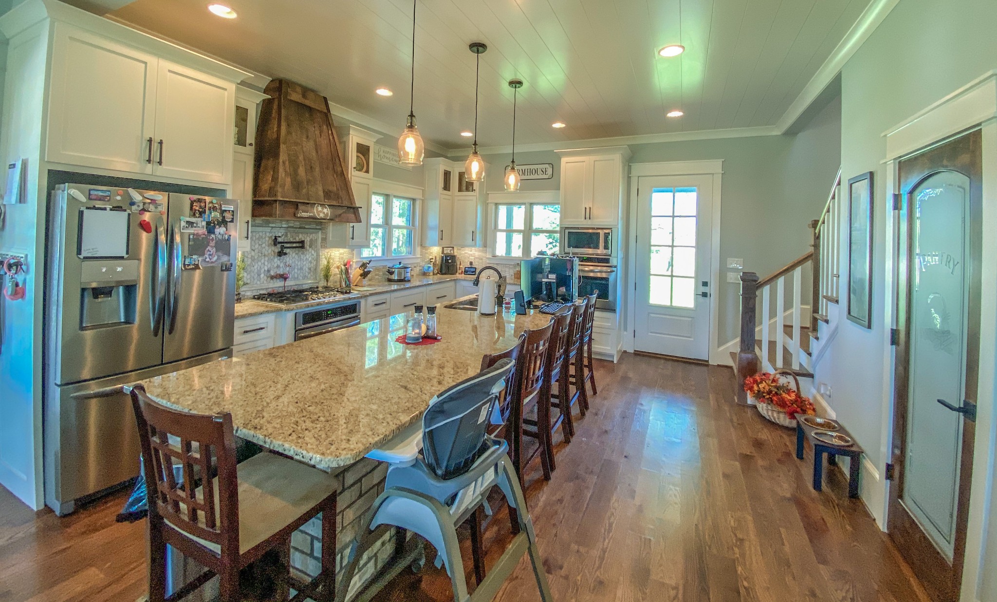 107 Walnut Grove Road Unionville, TN 37180 - Photo 3 of 21 a dining room with stainless steel appliances granite countertop a dining table chairs refrigerator and sink