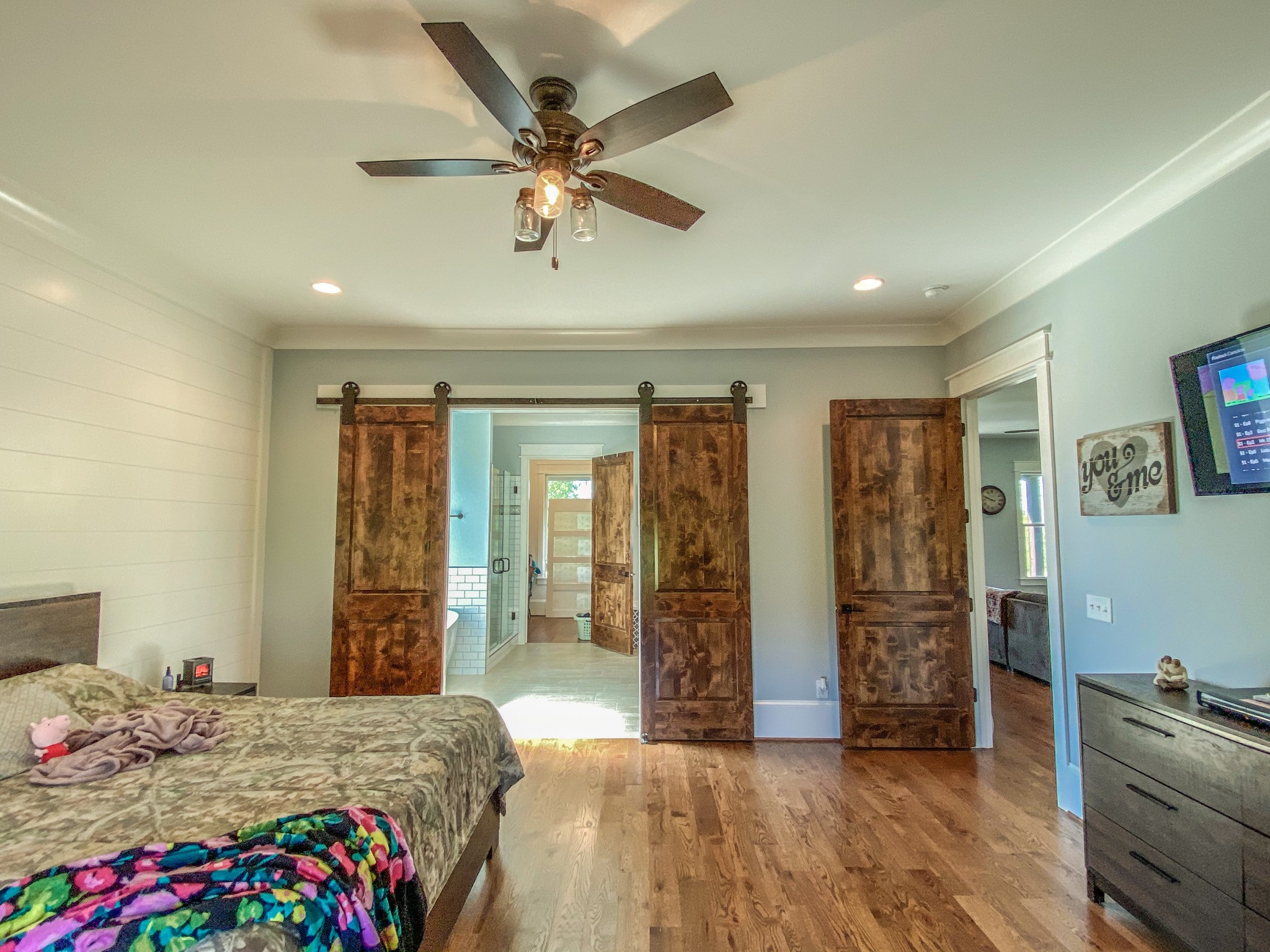 107 Walnut Grove Road Unionville, TN 37180 - Photo 8 of 21 a bedroom with a large bed and a chandelier