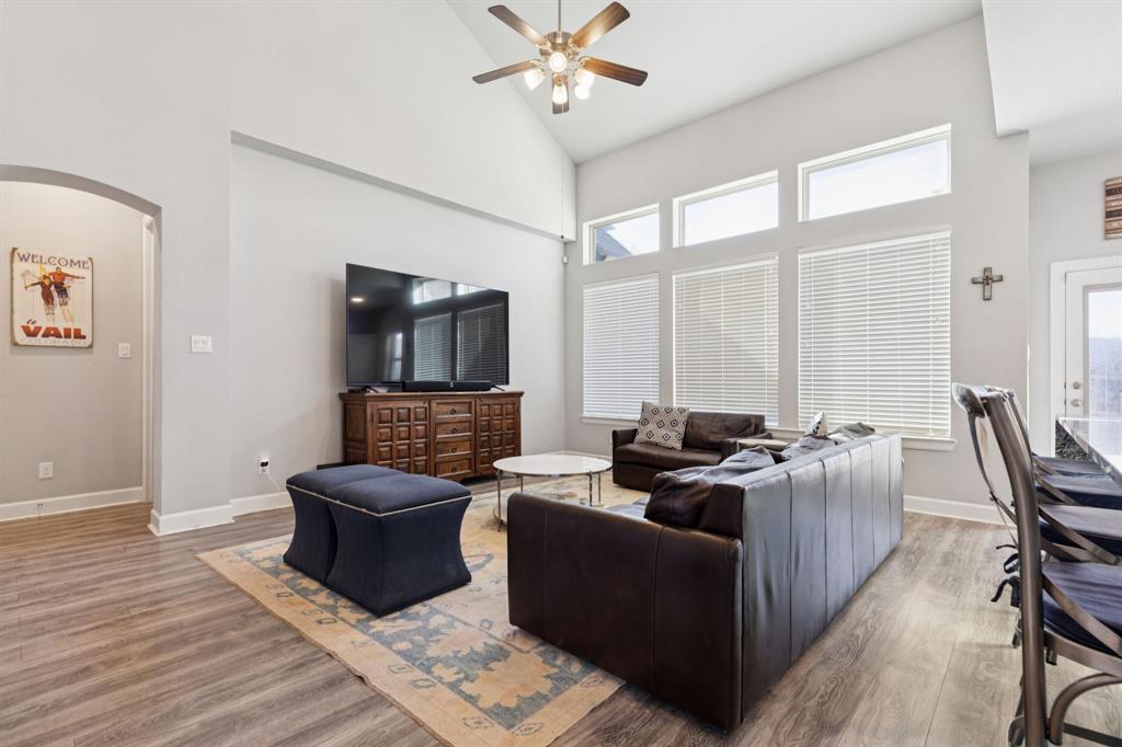 2000 Crescent Street Fort Worth, TX 76008 - Photo 11 of 40 a living room with furniture ceiling fan and a window
