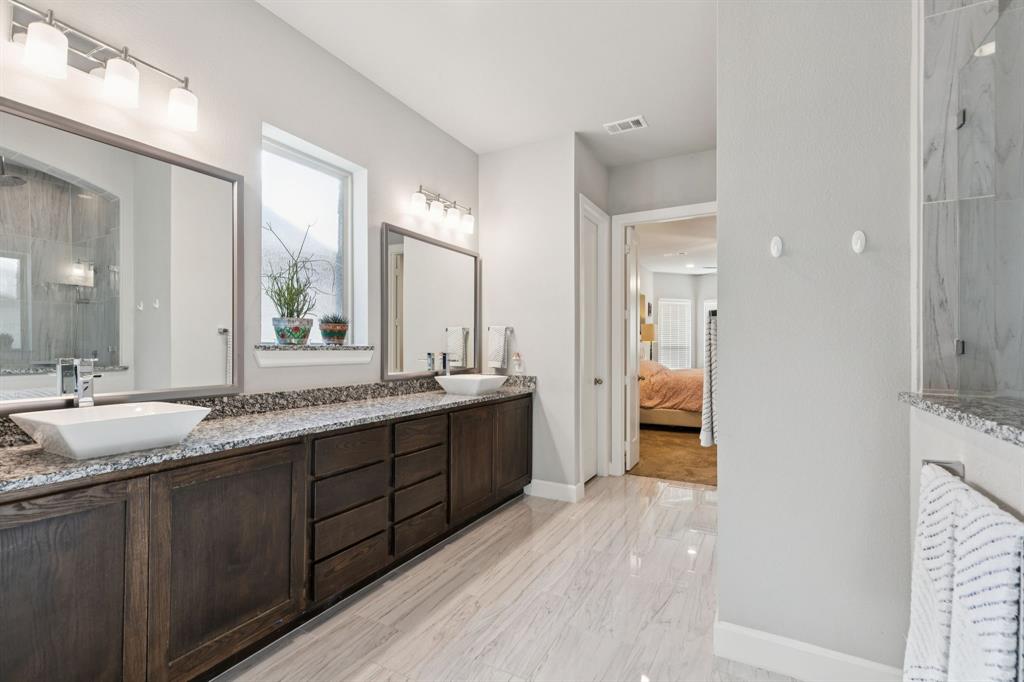 2000 Crescent Street Fort Worth, TX 76008 - Photo 15 of 40 a large bathroom with a granite countertop double vanity sink a mirror and a shower