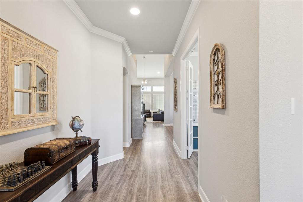 2000 Crescent Street Fort Worth, TX 76008 - Photo 19 of 40 a hallway with a stove and wooden floor