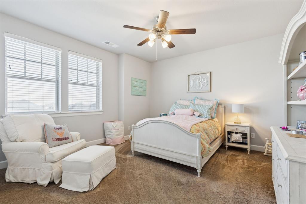 2000 Crescent Street Fort Worth, TX 76008 - Photo 25 of 40 a spacious bedroom with a bed and a couch