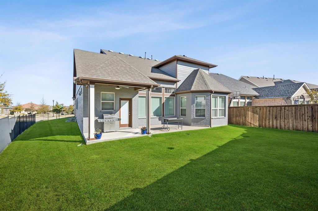 2000 Crescent Street Fort Worth, TX 76008 - Photo 30 of 40 a view of a house with a yard and porch with furniture