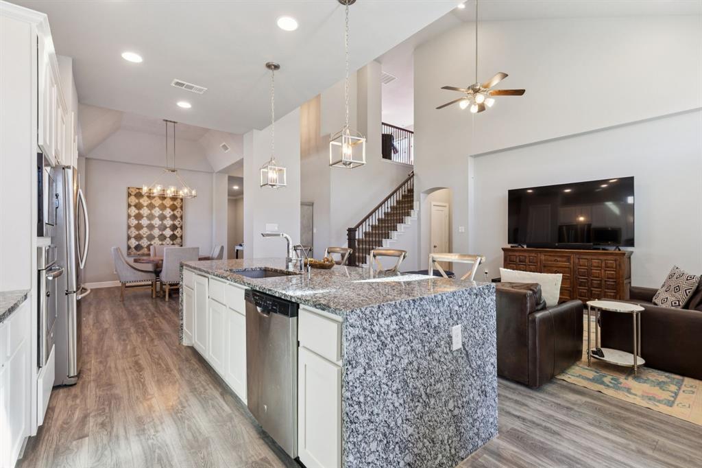 2000 Crescent Street Fort Worth, TX 76008 - Photo 8 of 40 a living room with furniture and a flat screen tv