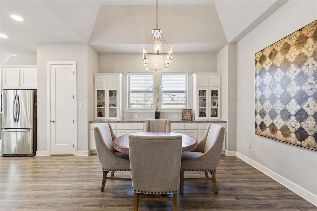 2000 Crescent Street Fort Worth, TX 76008 - Photo 10 of 40 a dining room with furniture a chandelier and wooden floor