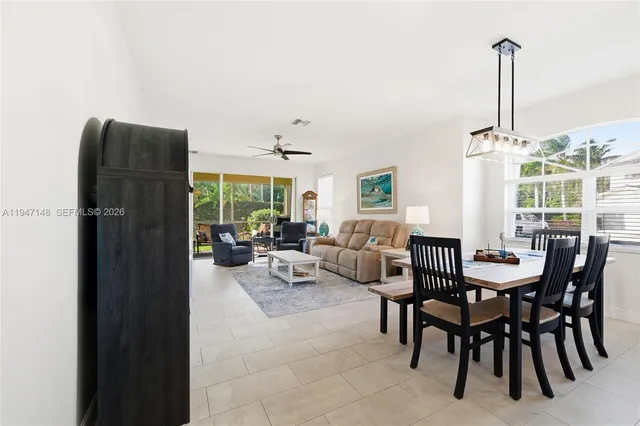 a dining room with furniture and window
