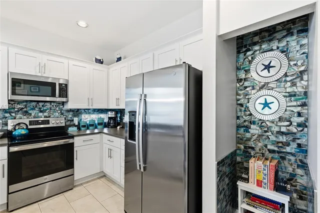 a bathroom with a double vanity sink a toilet and a mirror