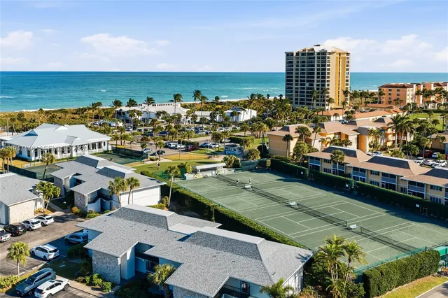 a living room with furniture and flowers