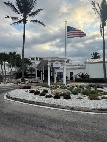 a view of a porch with furniture and garden