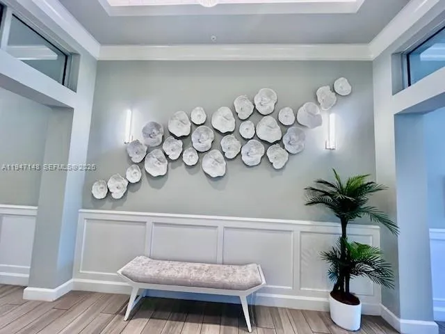 a living room with lots of furniture wooden floor and a book shelf