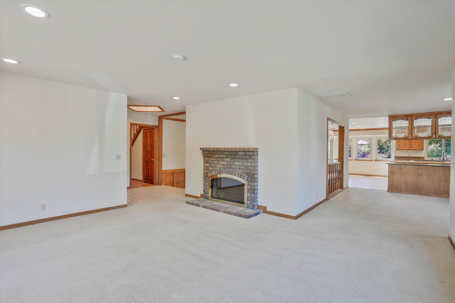 3029 Merrick San Way Carmichael, CA 95608 - Photo 13 of 31 a view of a livingroom with an empty space and a fireplace