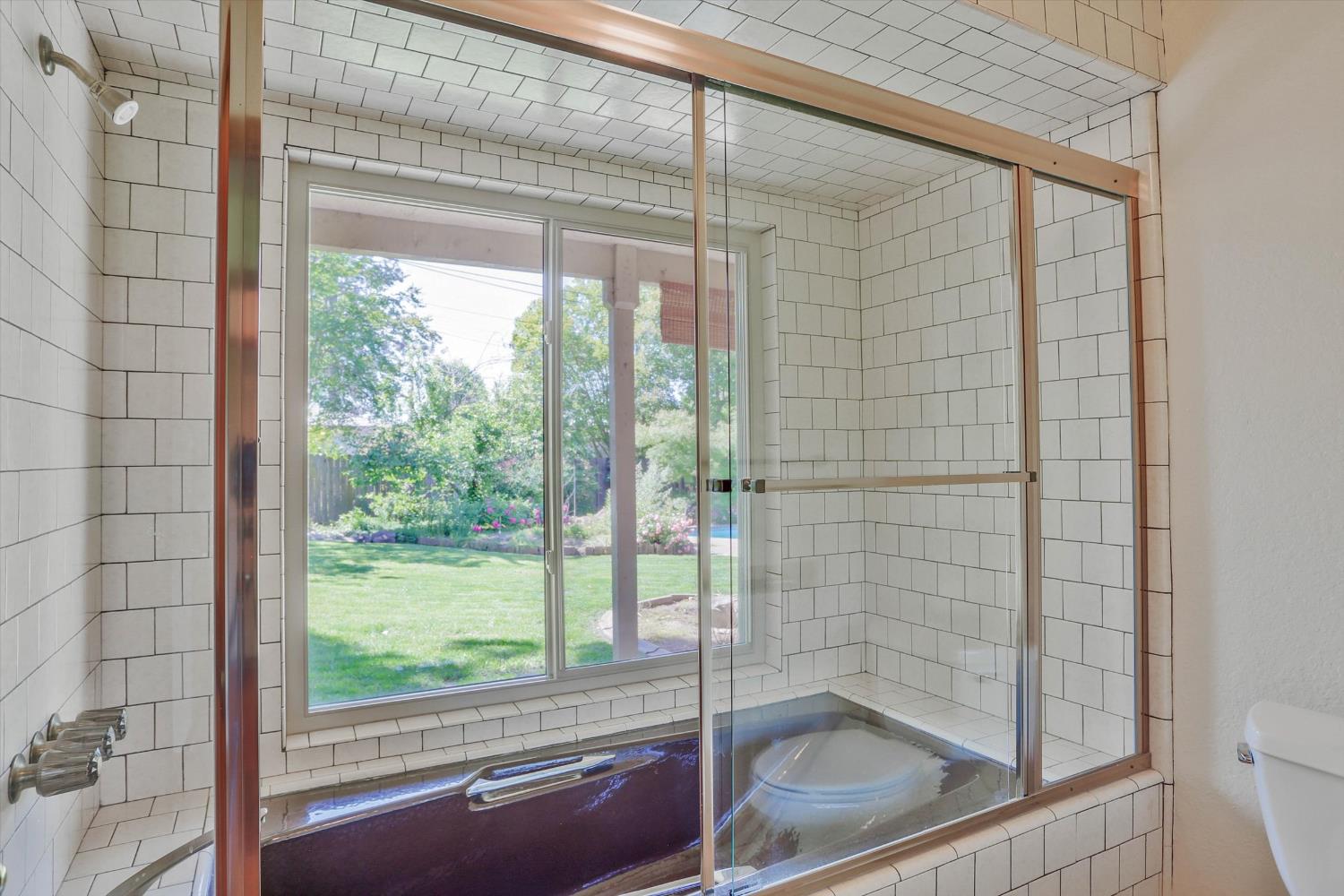 3029 Merrick San Way Carmichael, CA 95608 - Photo 21 of 31 a bathroom with a glass shower door