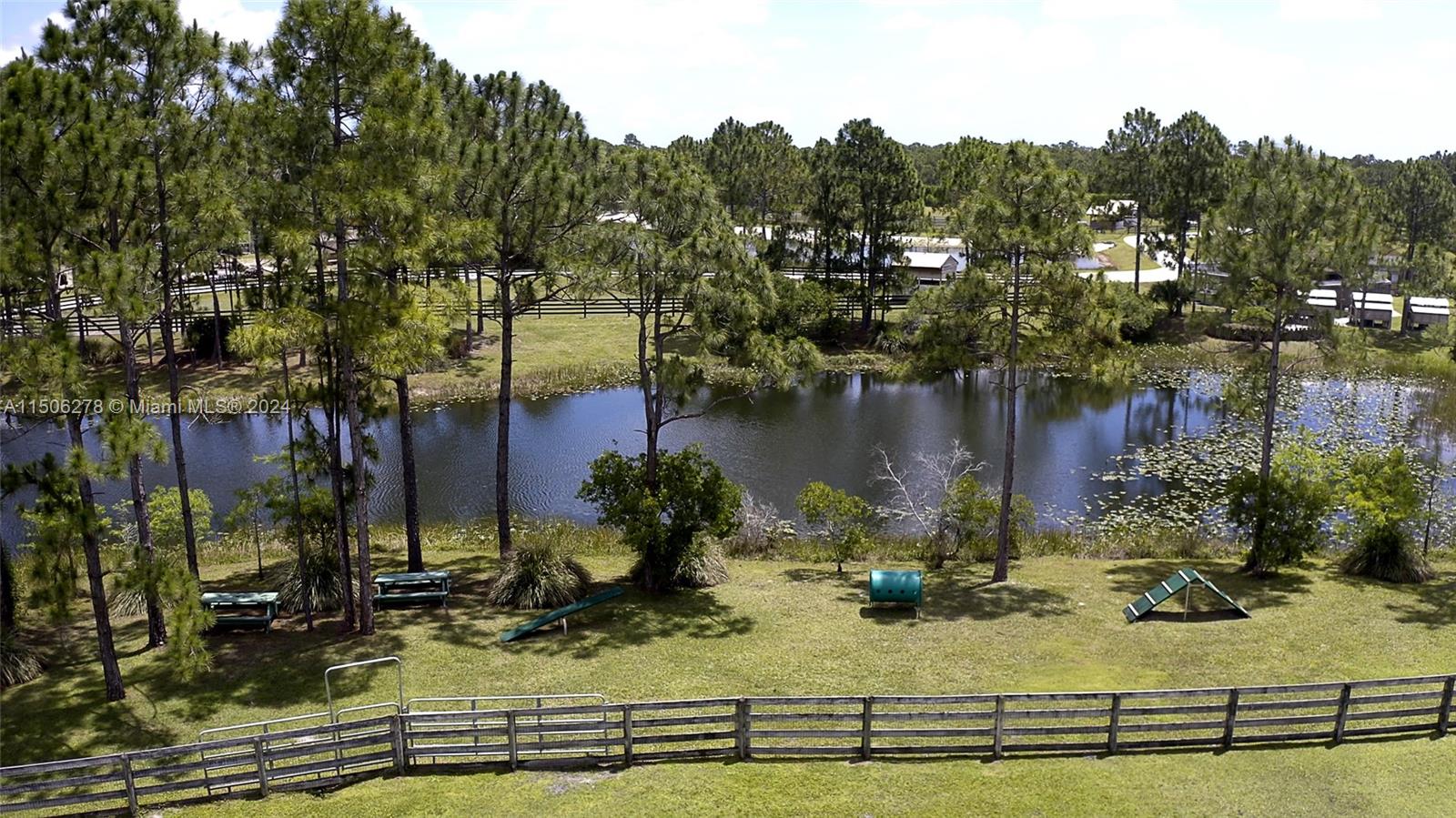 1500 Southeast Ranch Road South Jupiter, FL 33478 - Photo 12 of 29 a view of a lake with houses
