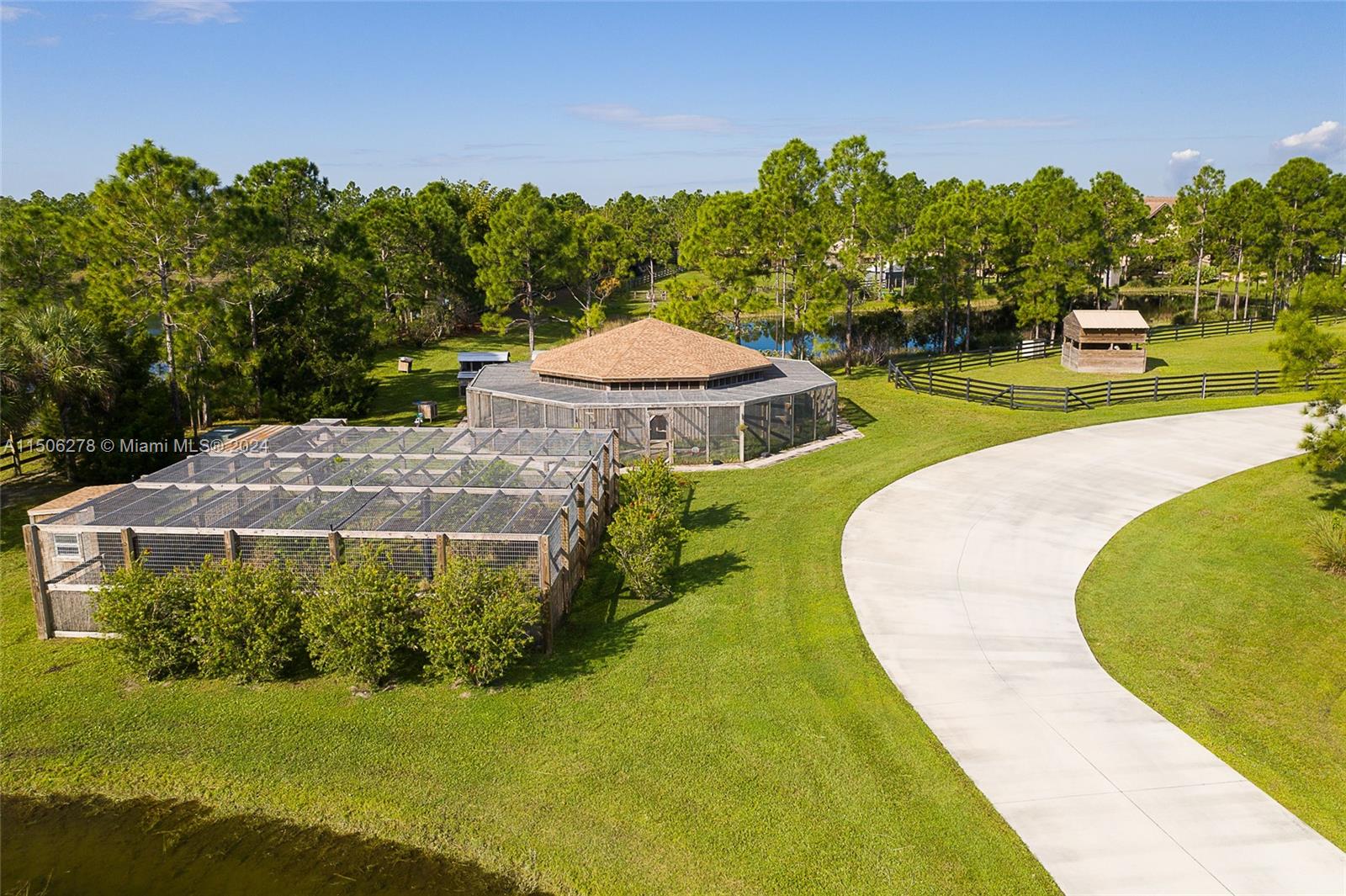 1500 Southeast Ranch Road South Jupiter, FL 33478 - Photo 14 of 29 a view of a swimming pool with an outdoor space and seating area